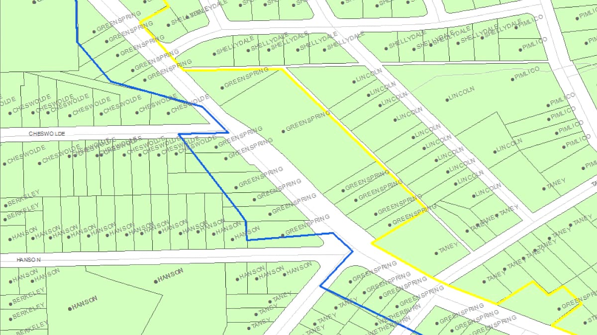 A parcel map of the Greenspring area shows blue and yellow lines marking alternative boundary alignments along residential streets.