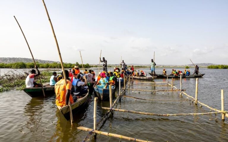 A group of people on the water at Densu Estuary in Accra, Ghana
