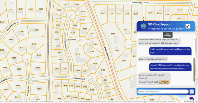 Screenshot of a map of a neighborhood divided by orange lines into separate lots, each labeled with a parcel number. On the right, a pop-up labeled “GIS Chat Support” features an inquiry by a user and the answer.