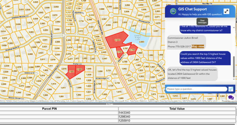 Screenshot of a map of a neighborhood divided by orange lines into separate lots, each labeled with a parcel number. Multiple lots are shaded red in response to an inquiry. On the right, a pop-up labeled “GIS Chat Support” features an inquiry by a user and the answer.