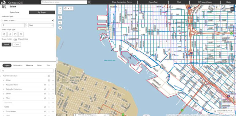 Screenshot of the CompassGIS Viewer Interface. A map of the San Diego Bay with blue and red lines indicating streets and borders, with a panel allowing the user to select attributes.