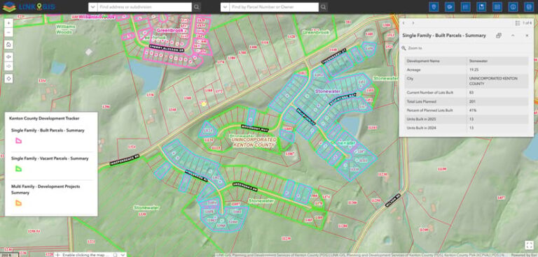 Screenshot of the Development Tracker interface, a green map of a neighborhood with lots colored blue and red. A legend and a pop-up display additional information about the development selected.