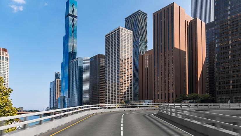 A street approaching skyscrapers signifies work verification for street sweepers