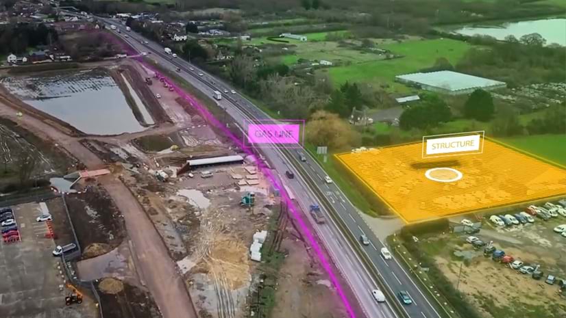 A bird\'s eye view of an interstate overlaid with locations of an important structure and gas line