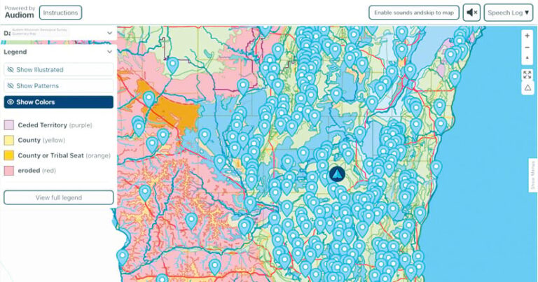 Majority blue and green map with splotches of pink and orange covered by blue location pins. A legend on the lefthand side indicates whether land is Ceded Territory, County, or County or Tribal Seat.
