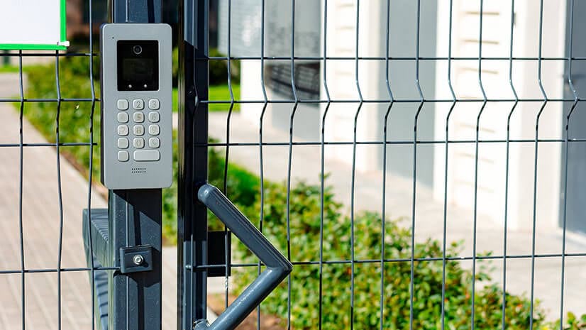 A keypad and wire fence signify measures used by security executives