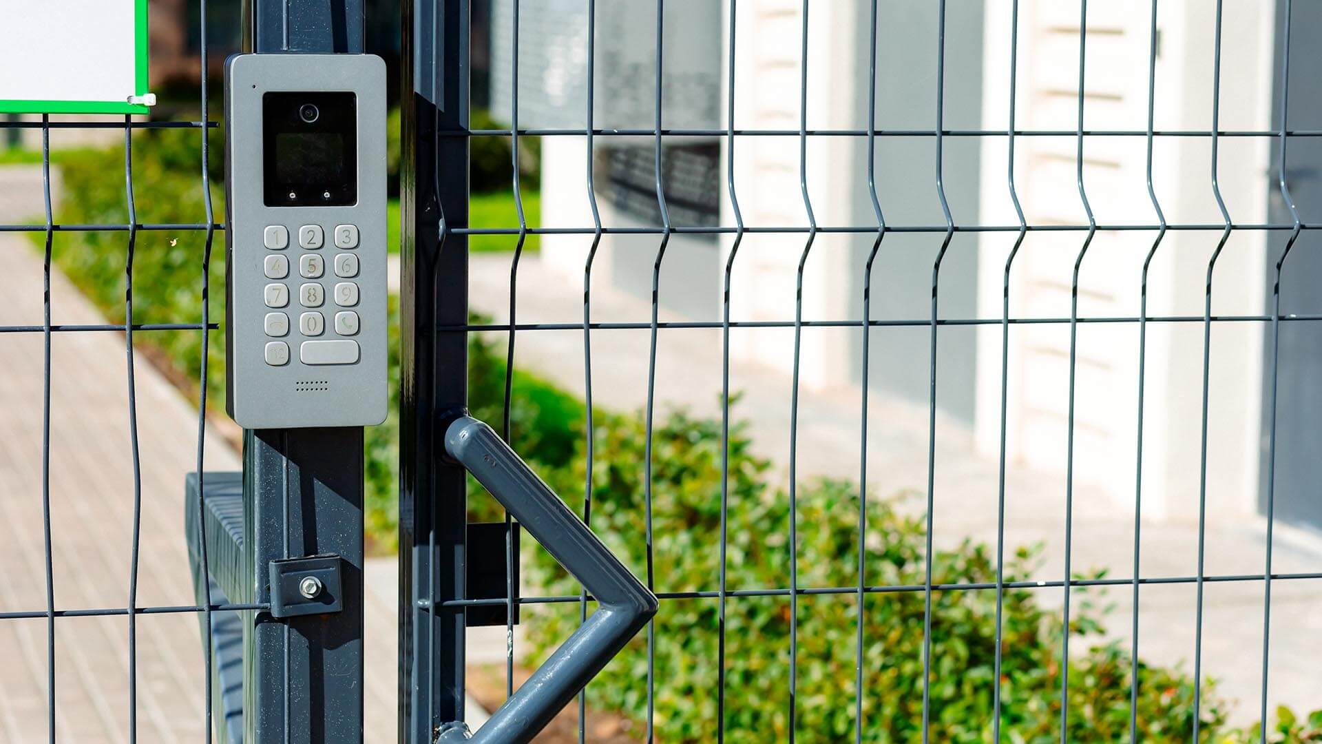 A keypad and wire fence are tools of security executives