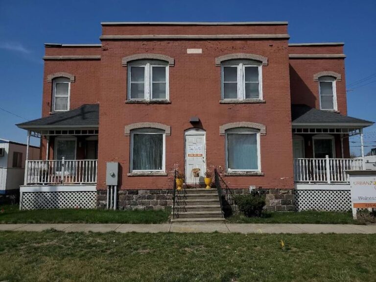 A historic apartment building in daylight in Kalamazoo