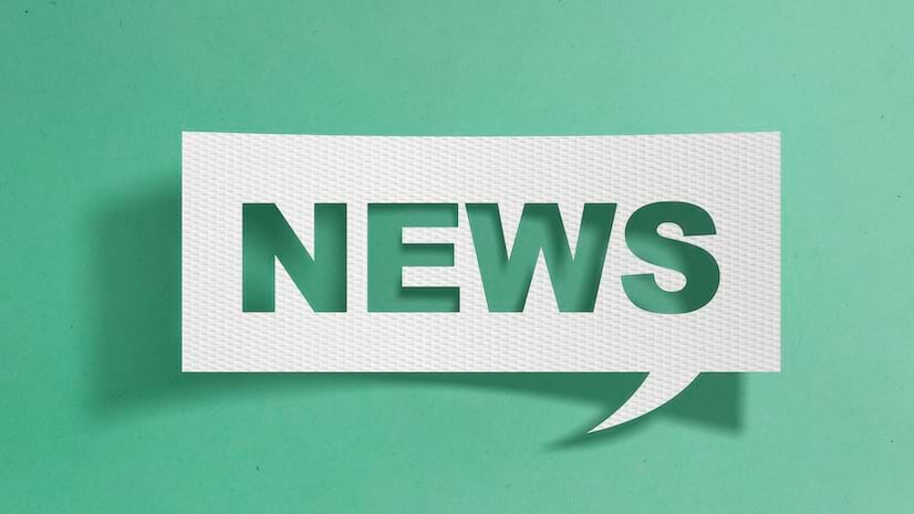 The word news in a word bubble on a green background