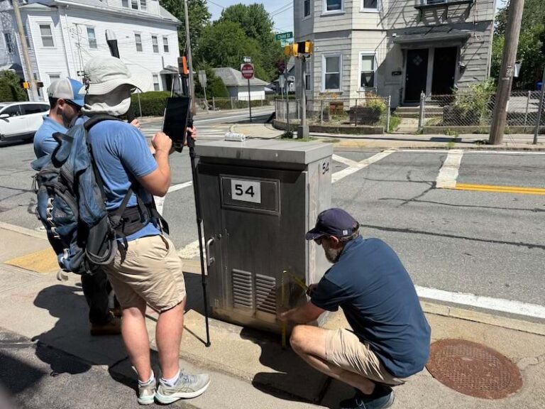 A team of researchers on a public street collecting data