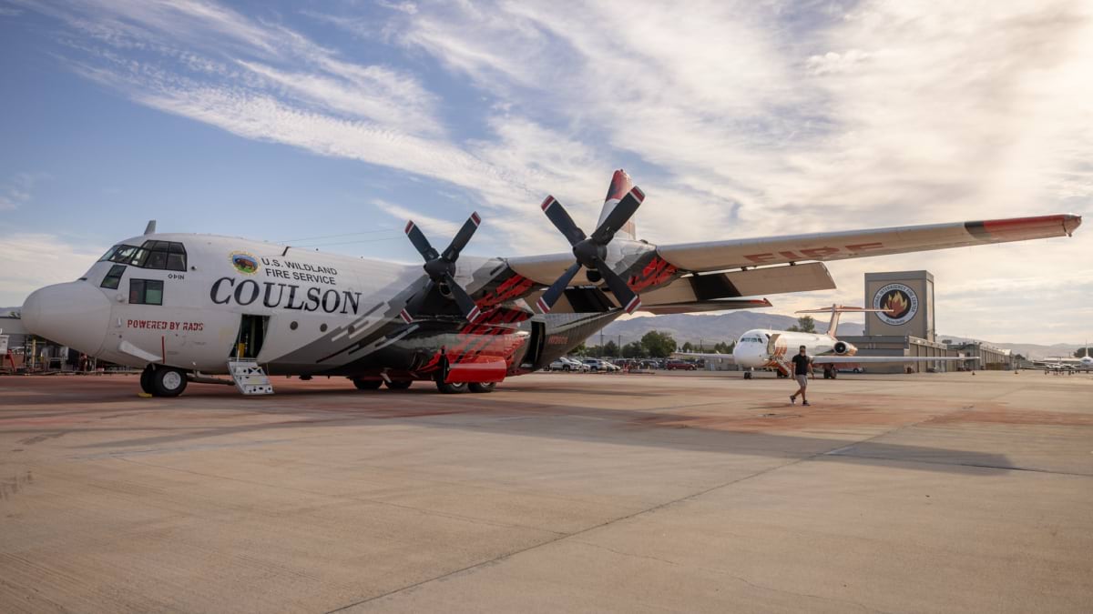 Large red-and-white air tanker parked on tarmac at the National Interagency Fire Center in Boise, Idaho.