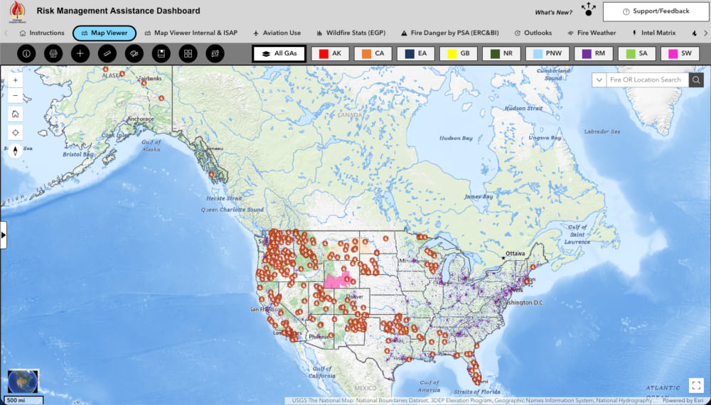 Screenshot of the Risk Management Assistance Dashboard showing a U.S. map with red markers indicating active wildfire locations nationwide.