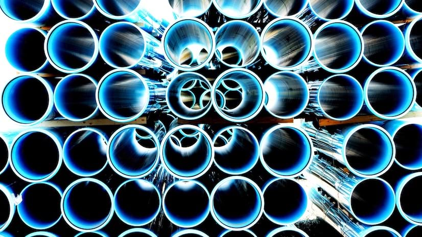 A stack of blue industrial pipes