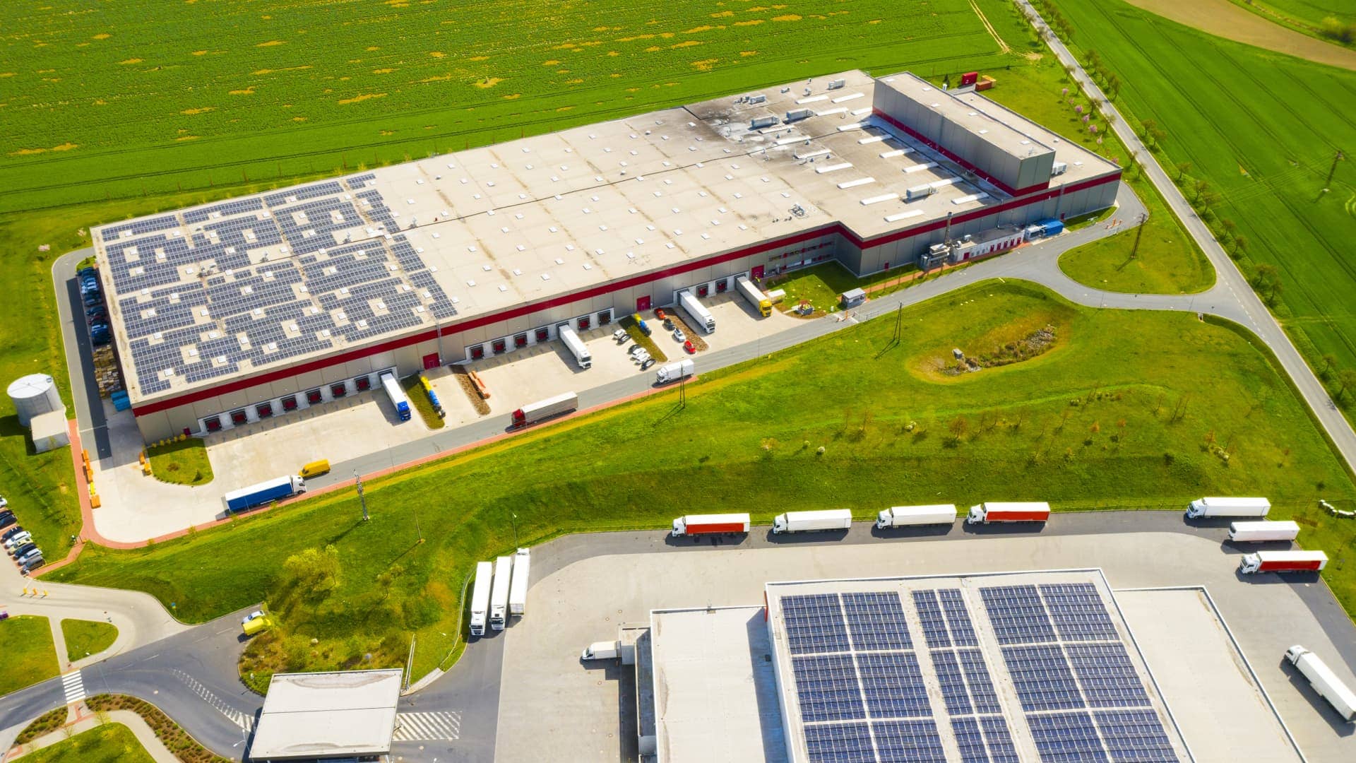 A warehouse roof with solar panels indicates solar potential