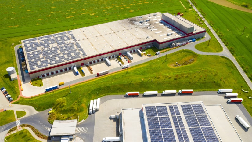 A warehouse roof with solar panels indicates solar potential