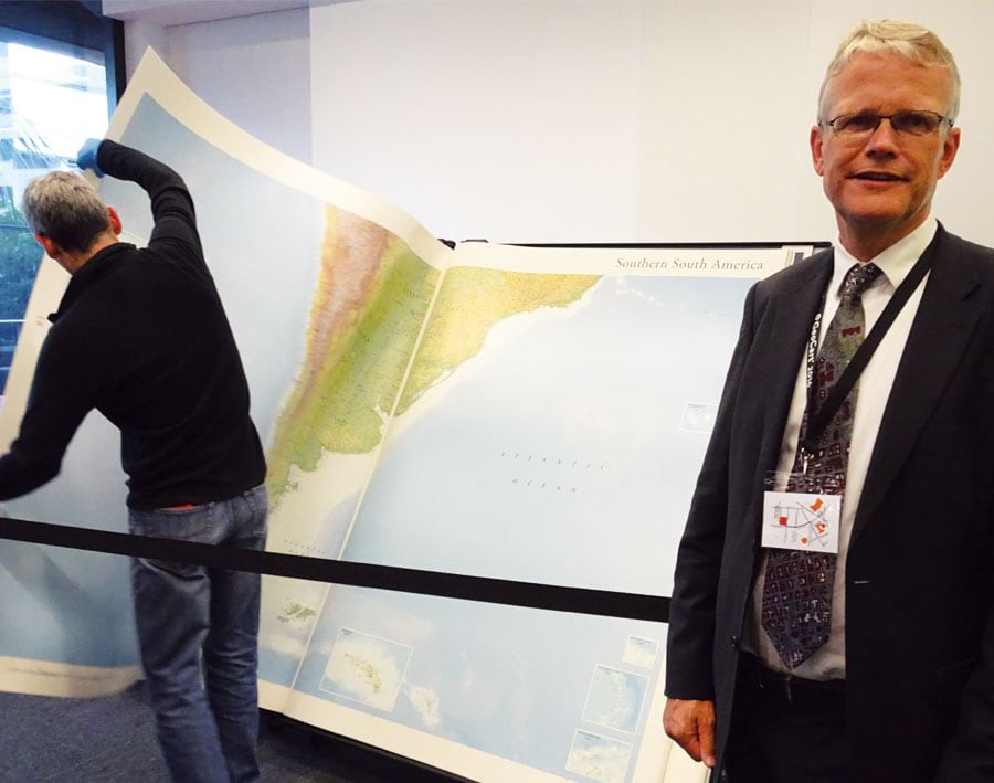 Menno-Jan Kraak with the world’s biggest atlas at the National Library of New Zealand in Wellington.