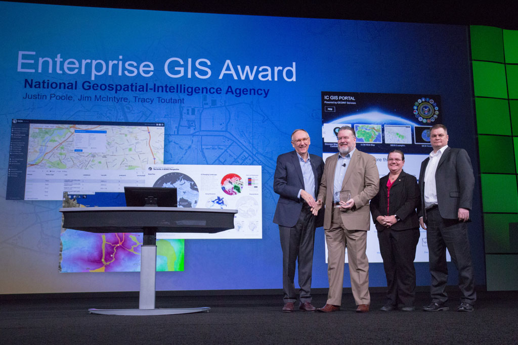 Dangermond congratulates the team from NGA. Dangermond congratulates the team from NGA.