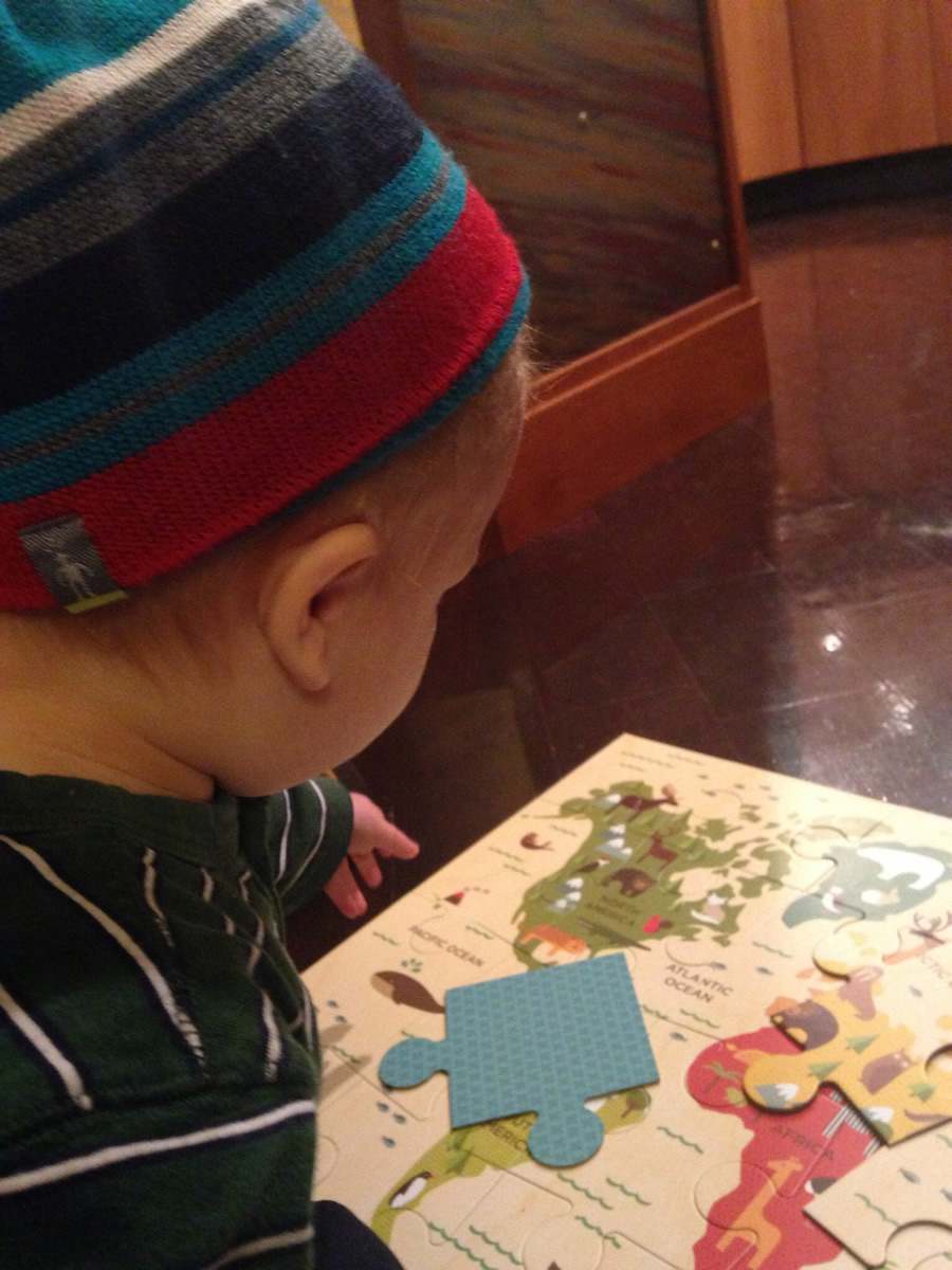 Miller puts together a puzzle of the world. Miller puts together a puzzle of the world.
