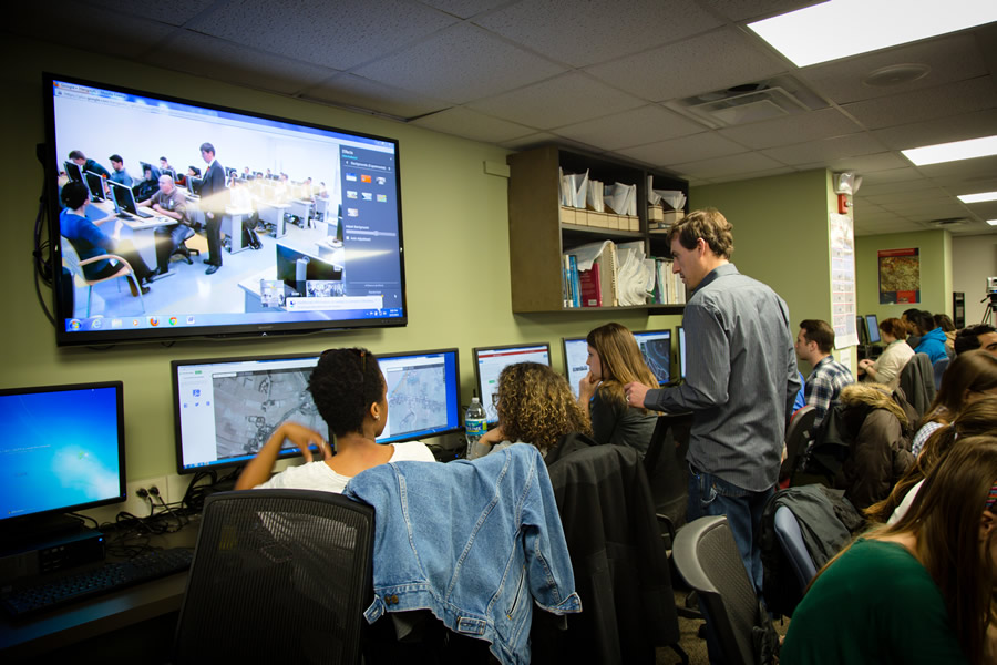 Chad Blevins from the USAID GeoCenter answers questions posed by George Washington University students during the mapathon. Photo/Heather Blevins