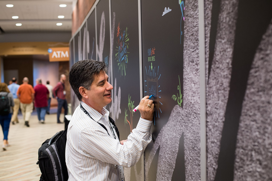 DevSummit attendees left creative messages and drawings on a chalk board inside the Palm Springs Convention Center.