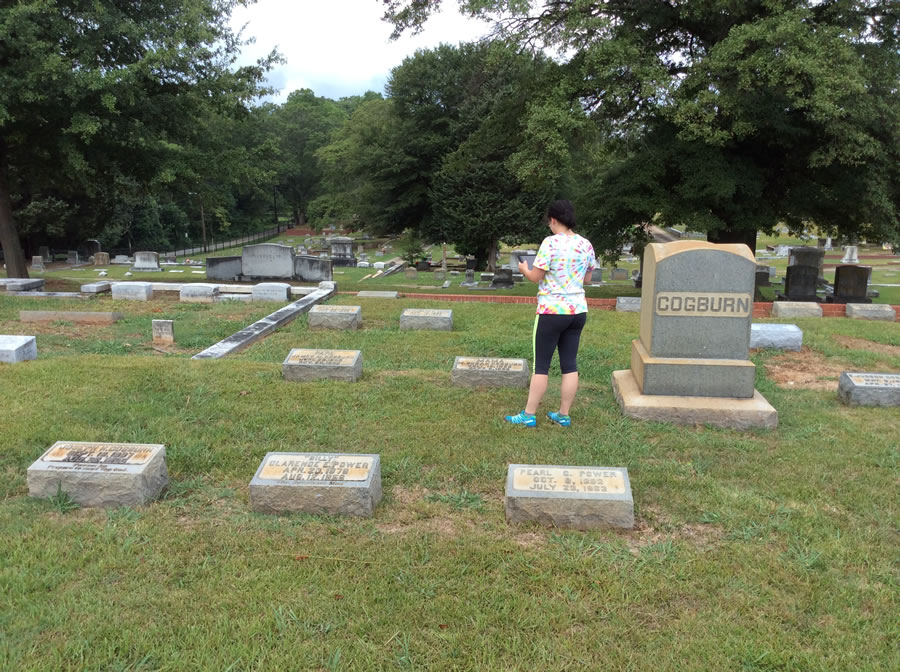 In the midst of Georgia's scorching summer heat, Alexandra "Allie" Ingram photographed grave markers so the GIS team could attach them to a grave marker layer in ArcGIS Online.