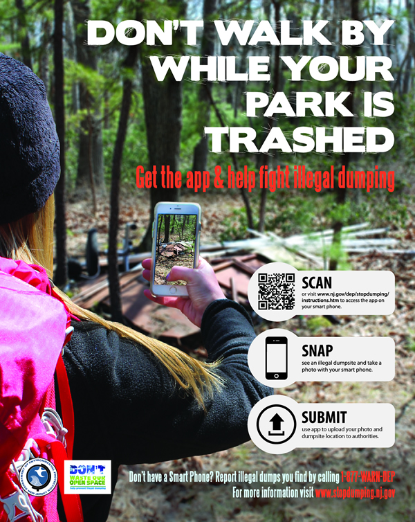 A poster advertises the browser-based app that people can use on their smartphones to report illegal dumping. A poster advertises the browser-based app that people can use on their smartphones to report illegal dumping.