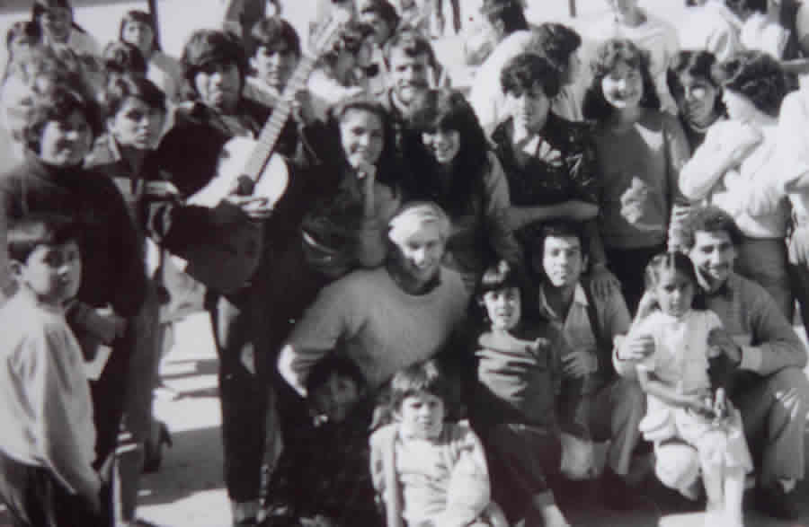 This photograph is a memento from Richard Resl's trip to Bolivia 30 years ago. He's surrounded by a group of young people in the main plaza in Tarija, Bolivia. Photo courtesy of Richard Resl.