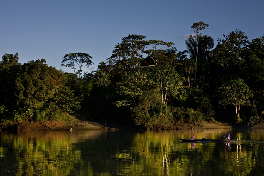Resl found an affinity for the Amazon. Here, a canoe skims across the waters in Yasuni, a rainforest in northeastern Ecuador that's the ancestral home to the Waorani people. Photo/Kelly Swing.