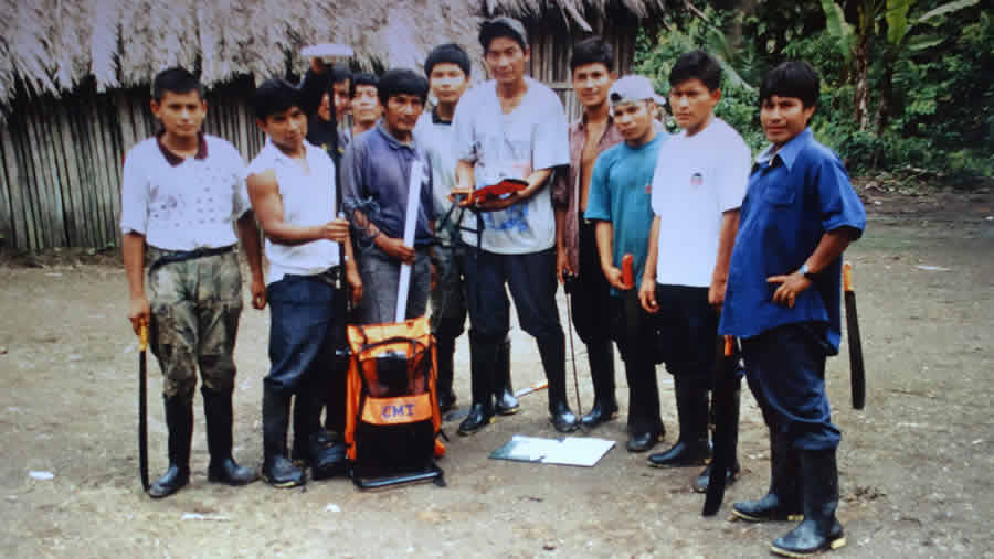 A group of Shuar leaders posed in 1998 with a GPS device that was used to help map their territory. Photo courtesy of AmazonGISnet.