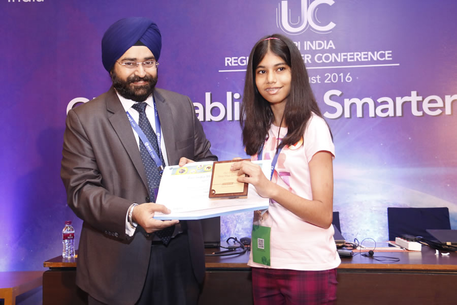 Harpreet Singh from Esri India presents the third place award in the Esri India Story Maps Contest to Mahika Srivastava. Harpreet Singh from Esri India presents the third place award in the Esri India Story Maps Contest to Mahika Srivastava.