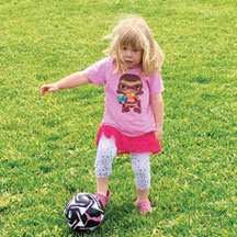 Pepper channels shows her Esri map girl shirt on the soccer field, outside San Francisco, California