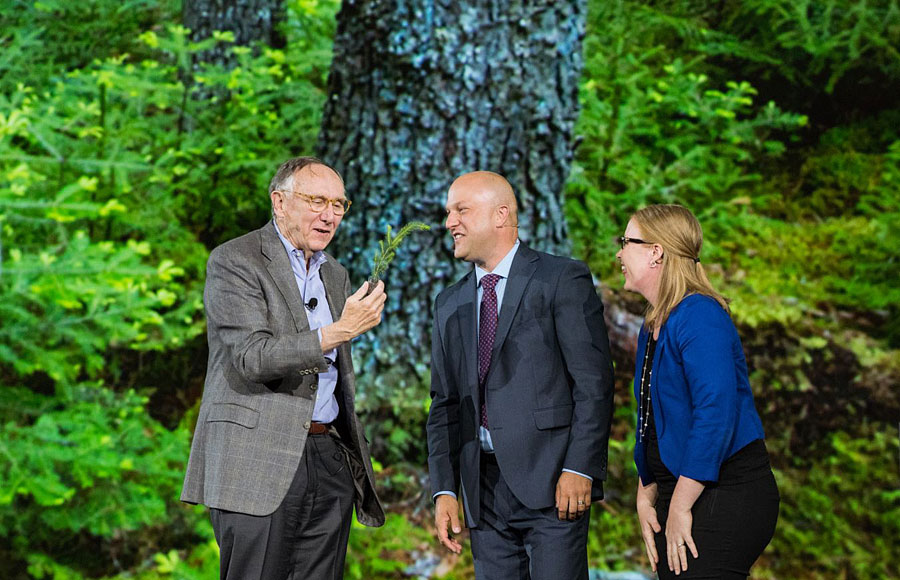 Dangermond receives a seedling from Heather Morrison and Jason Killam.