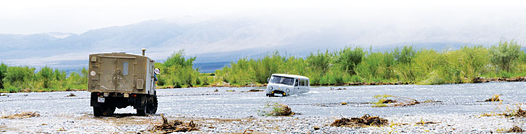 Research vehicles must ford rivers to reach some remote sampling sites in Mongolia. (Photo courtesy of Alain Maasri.)