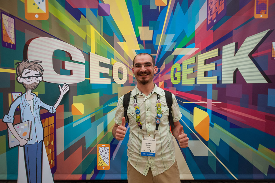 A GIS software engineer stops for a photo with Dev Dude (left). A GIS software engineer stops for a photo with Dev Dude (left).