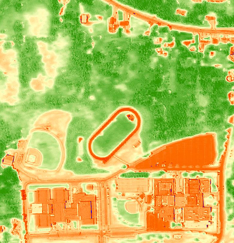 This high-resolution aerial imagery from the Normalized Difference Vegetation Index (NDVI) shows vegetation in contrast to built areas around a residential neighborhood in the United States.