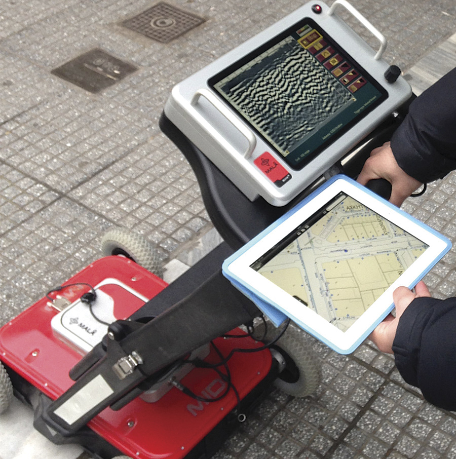 Aided by mobile GIS, an EYATh employee uses a ground-penetrating radar device to more accurately identify underground network assets.