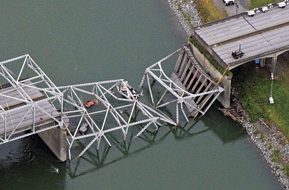 Part of the Skagit River Bridge collapsed when a tall semi-truck, driving in the wrong lane, struck its trusses.