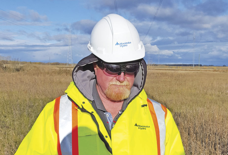 A fieldworker for Manitoba Hydro, a major energy utility in Manitoba, Canada, uses VisualSpection augmented reality smart glasses to record GIS information about a power line corridor.