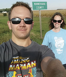 Josh Hellman and Heidi Jerke are wearing the Magnificent Mapgirl and Amazing Mapman T-shirts