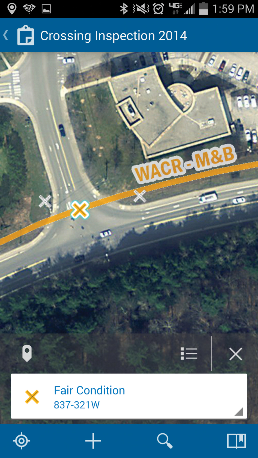 Tapping the mobile screen selects a crossing feature during field inspections.