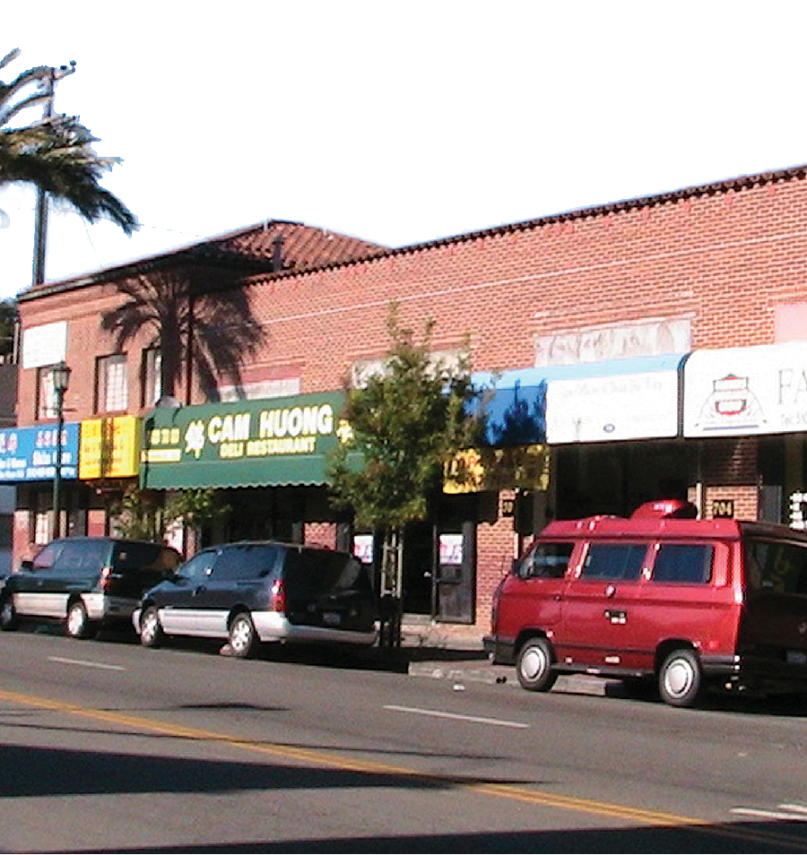 Flat-roofed building types varied in design and use and included retail shops, apartment buildings, and big-box retail locations.