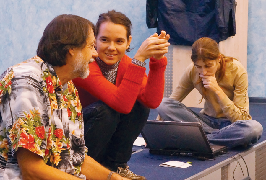 John Schaeffer discusses teaching issues with Ela Šegina as Ilona Zhuravleva prepares for her lecture at the ArcGIS for Environmental Analysis class in Moscow.