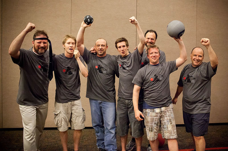 The Balls, last year's dodge ball tournament winners, gloat about their triumph. Yes, that's a necktie headband.