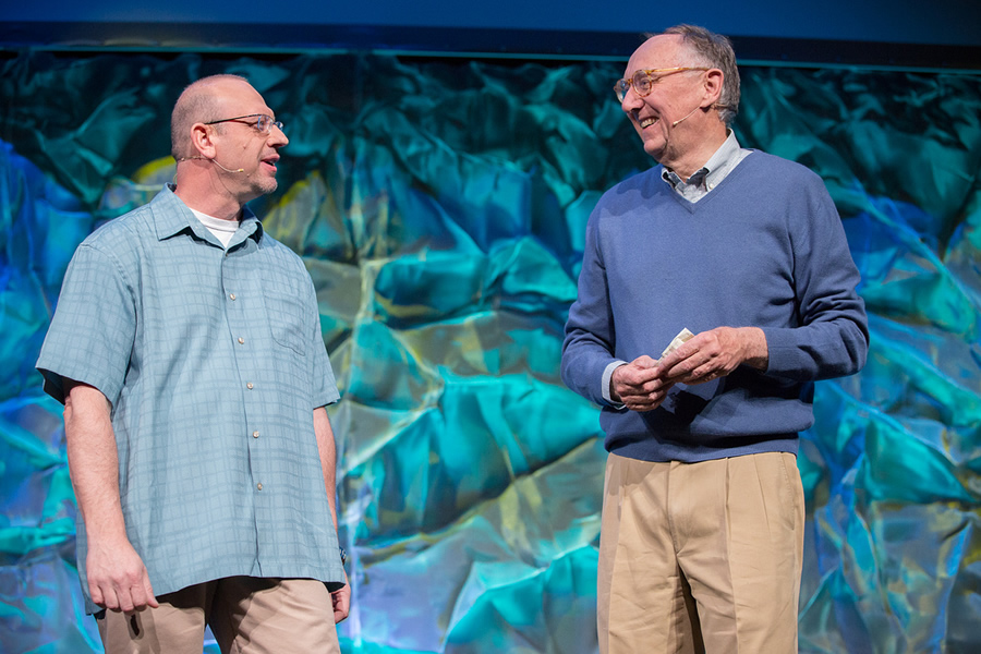 Esri program manager Jim McKinney (left) and Esri president Jack Dangermond welcome developers back to Palm Springs.