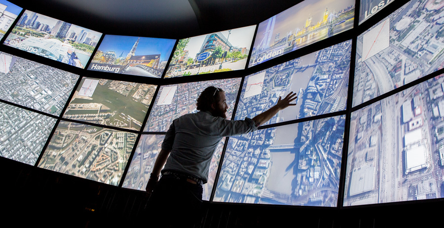 A Map Gallery visitor explores the Urban Observatory. A Map Gallery visitor explores the Urban Observatory.