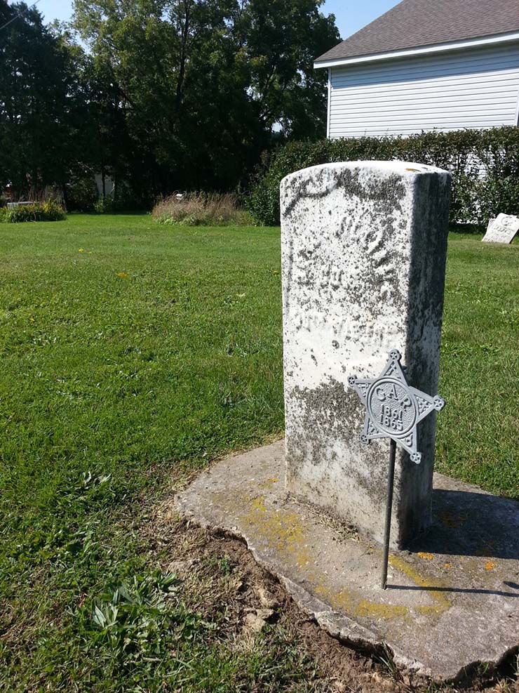 A Grand Army of the Republic medallion identifies that the person buried here was a Civil War veteran. Photo by Troy Maggied. A Grand Army of the Republic medallion identifies that the person buried here was a Civil War veteran. Photo by Troy Maggied.