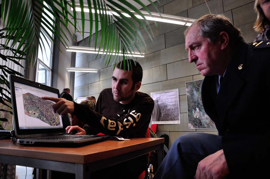 Martin Besta from Technical University in Liberec demonstrates the use of new technologies in combination with historical maps to Miloslav Miksánek, who works for the Fire Rescue Service for the Liberec Region. Martin Besta from Technical University in Liberec demonstrates the use of new technologies in combination with historical maps to Miloslav Miksánek, who works for the Fire Rescue Service for the Liberec Region.