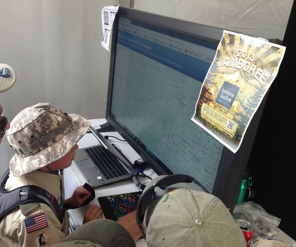 A group of Boy Scouts use an app available in ArcGIS Online to see the hometowns of their fellow scout troops.