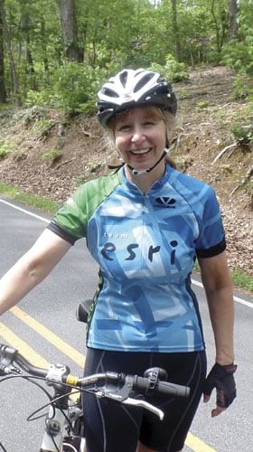 Maureen Miller wears her Esri jersey while bike-riding