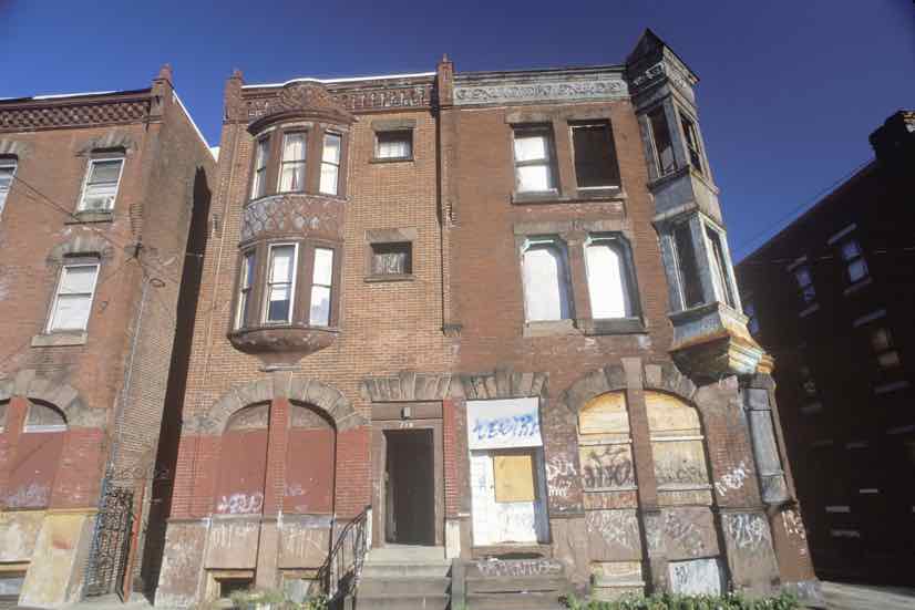 boarded up row house